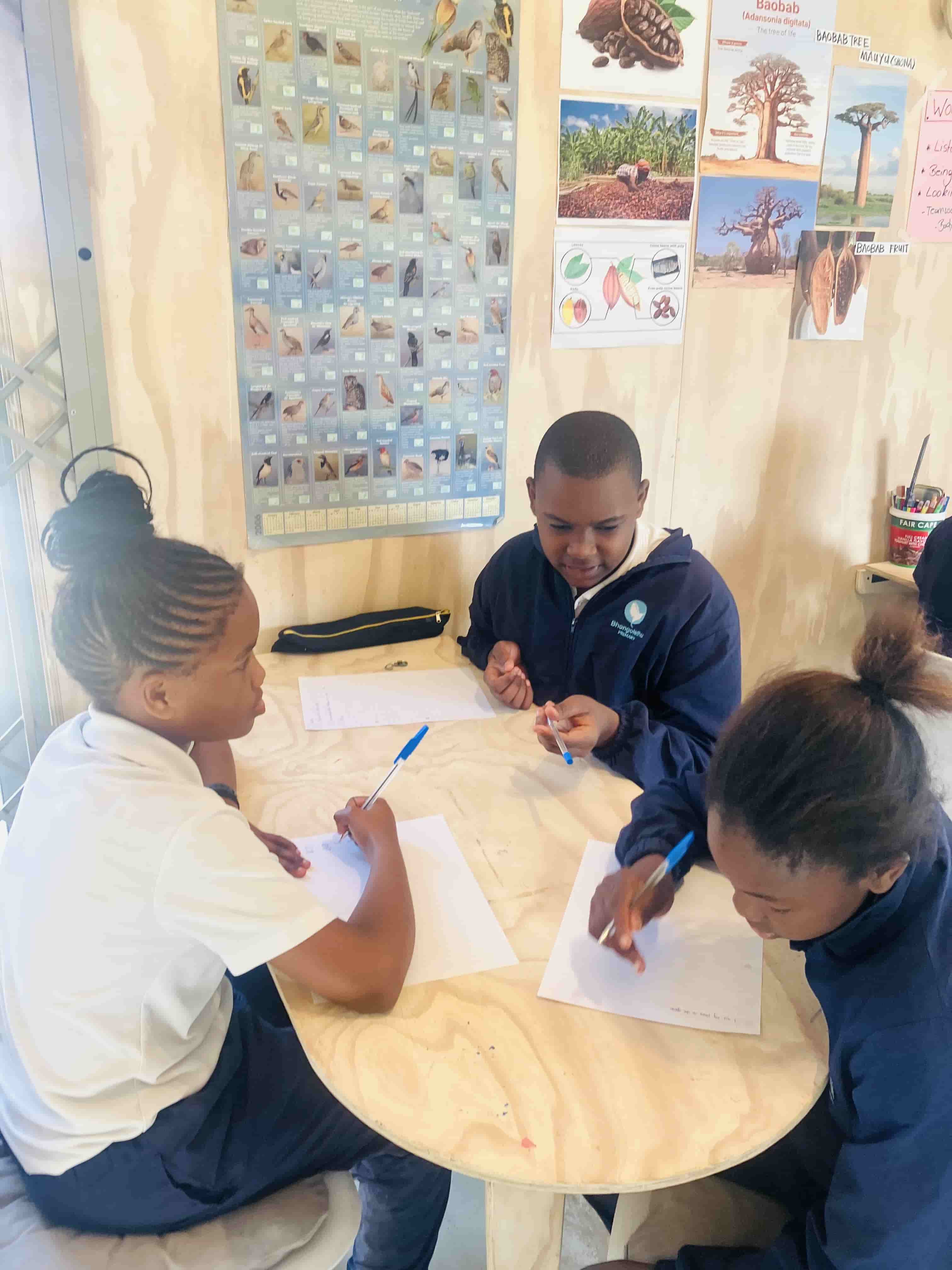 Young people taking part in a writing workshop