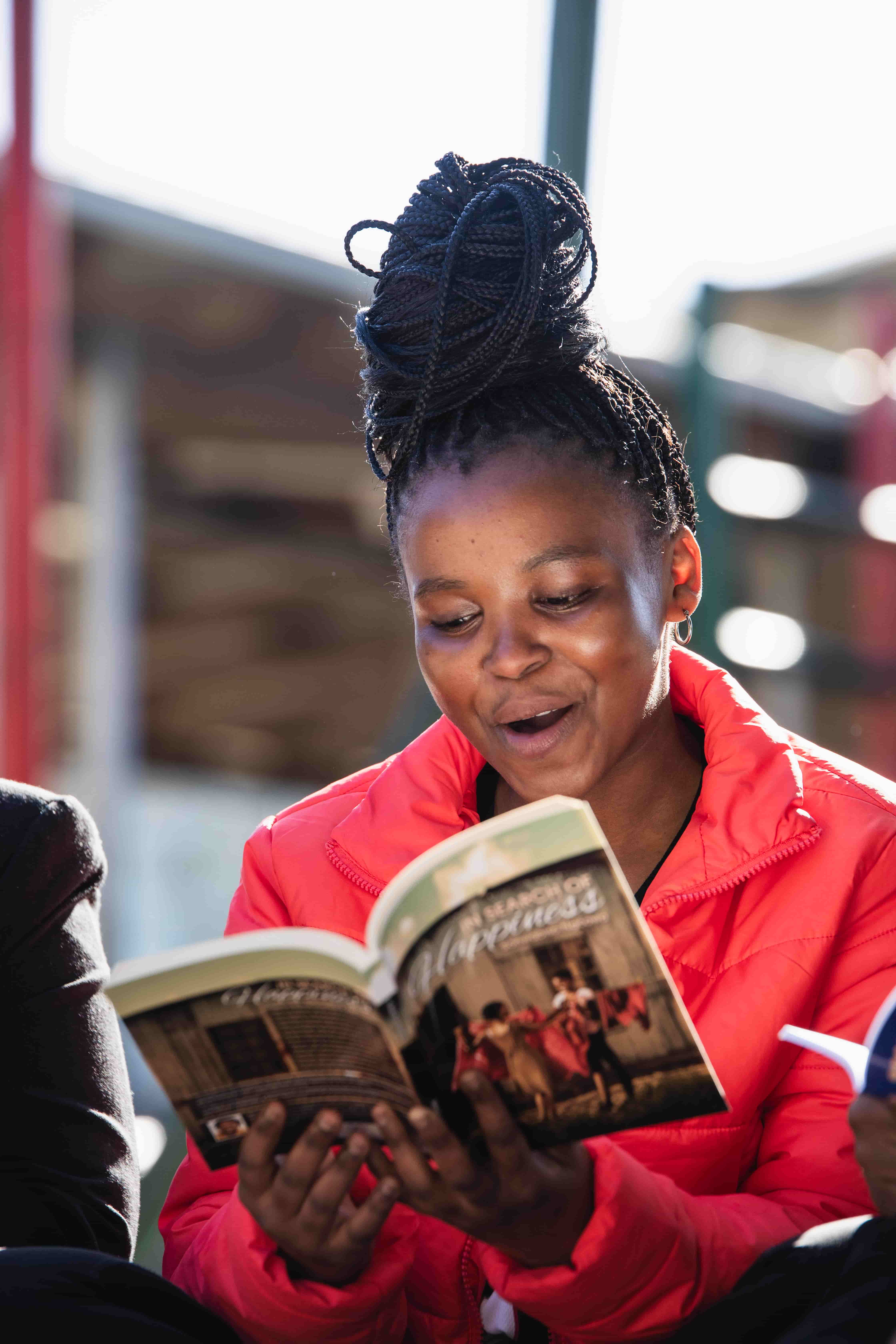 A young woman reading a book